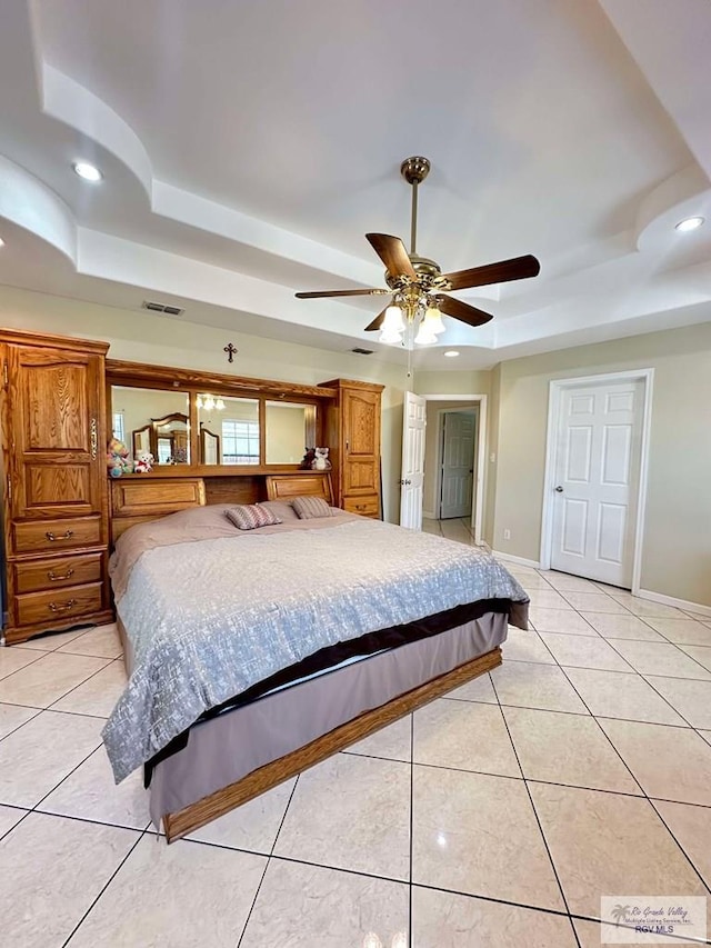 bedroom with recessed lighting, a raised ceiling, light tile patterned flooring, and visible vents