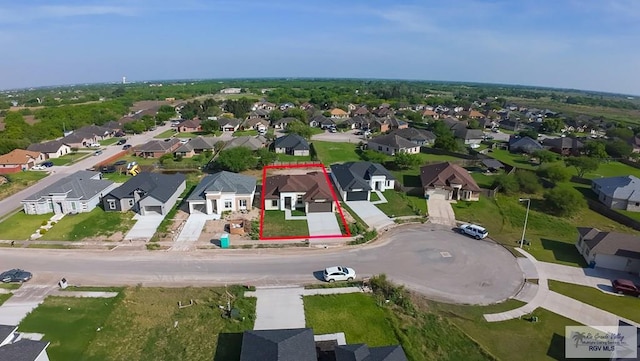 birds eye view of property with a residential view
