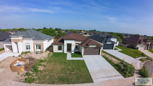 view of front of home featuring a residential view, driveway, an attached garage, and a front lawn