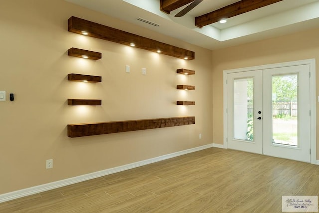 entrance foyer with french doors, baseboards, beam ceiling, visible vents, and wood finished floors