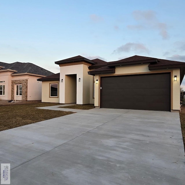 prairie-style house with a garage