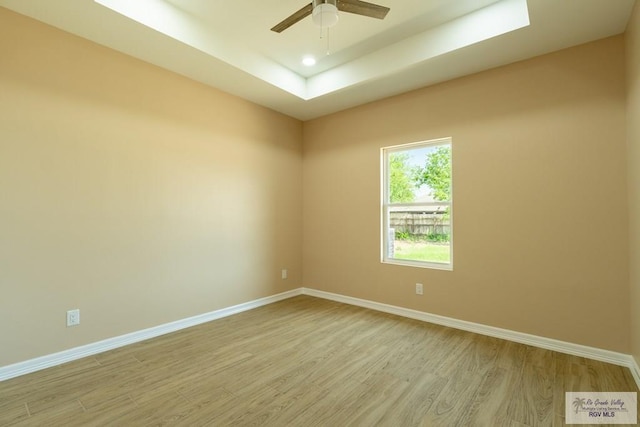unfurnished room featuring light wood-style flooring and baseboards