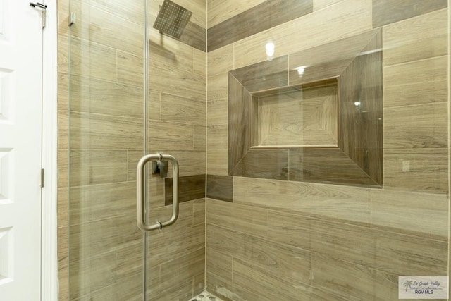 bathroom with a shower stall