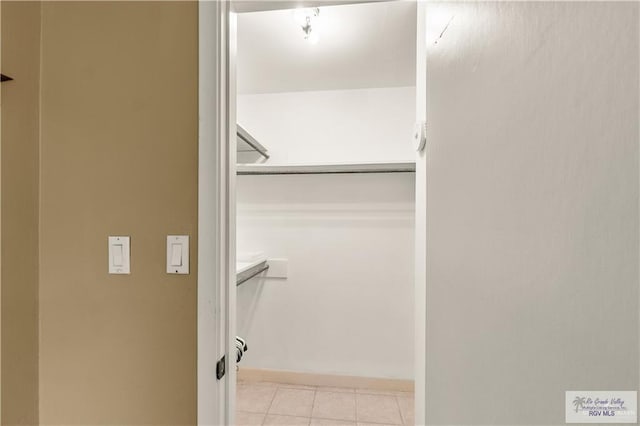 22 Shenandoah River Dr, Brownsville, TX 78520 - walk in closet with light tile patterned flooring
