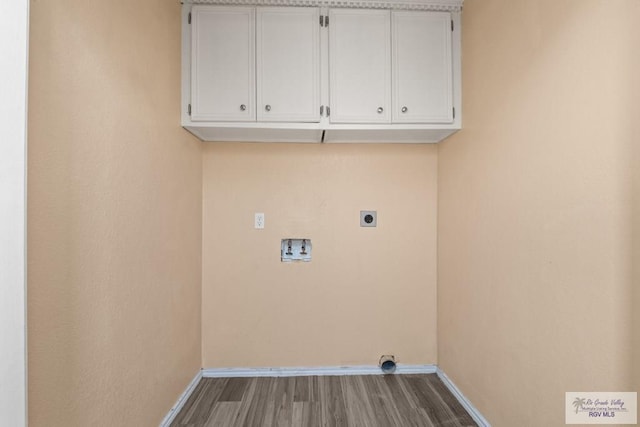 3673 Rey Enrique Dr, Brownsville, TX 78521 - laundry room featuring washer hookup, baseboards, electric dryer hookup, and wood finished floors