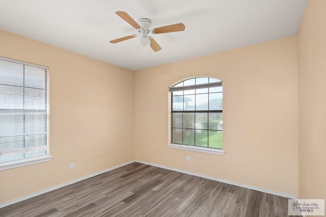 3673 Rey Enrique Dr, Brownsville, TX 78521 - unfurnished room with wood finished floors, ceiling fan, and baseboards