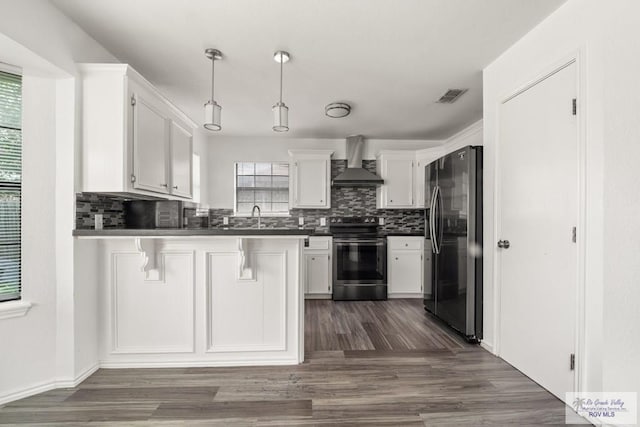 3673 Rey Enrique Dr, Brownsville, TX 78521 - kitchen with appliances with stainless steel finishes, wall chimney exhaust hood, a peninsula, and healthy amount of natural light