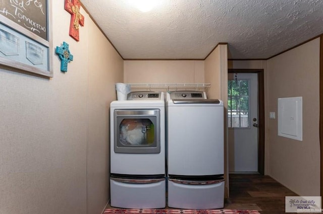 818 S 18th St, Alamo, TX 78516 - clothes washing area featuring a textured ceiling, separate washer and dryer, electric panel, wood finished floors, and laundry area