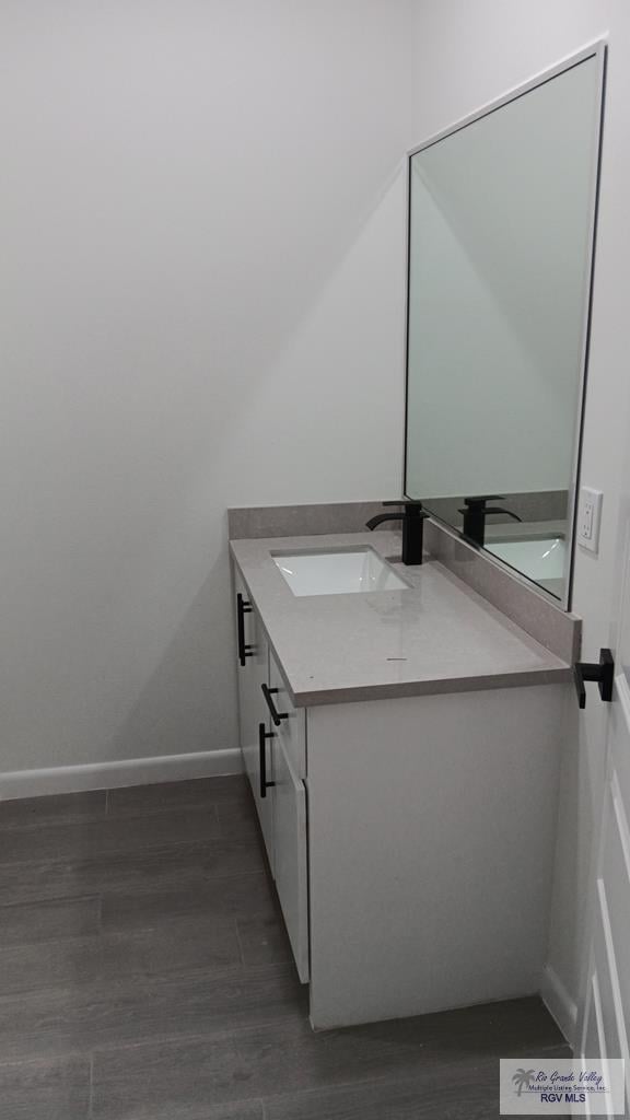 bathroom featuring hardwood / wood-style floors and vanity