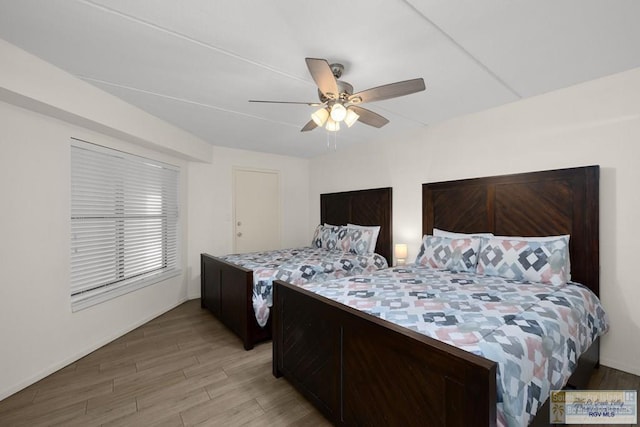 406 Padre Blvd Unit 207, South Padre Island, TX 78597 - bedroom with light wood-style floors and a ceiling fan