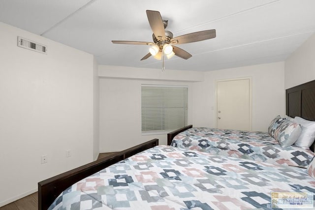 406 Padre Blvd Unit 207, South Padre Island, TX 78597 - bedroom with ceiling fan and wood finished floors