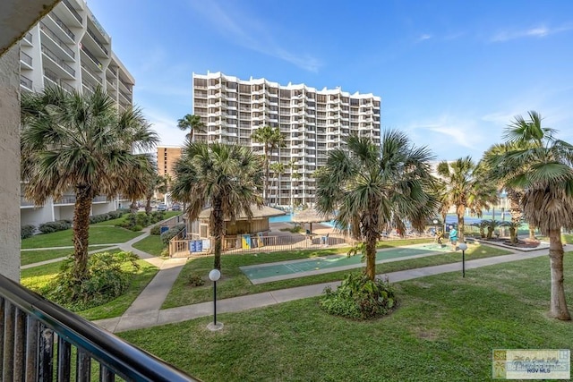 406 Padre Blvd Unit 207, South Padre Island, TX 78597 - view of community featuring shuffleboard and a yard