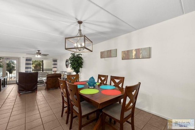 406 Padre Blvd Unit 207, South Padre Island, TX 78597 - tiled dining room with a chandelier and a ceiling fan