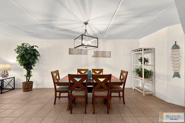 406 Padre Blvd Unit 207, South Padre Island, TX 78597 - dining area with light tile patterned floors and a chandelier