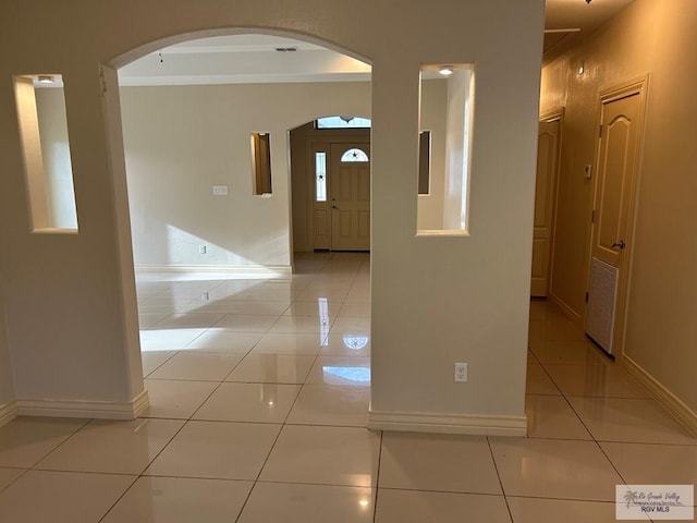 corridor featuring light tile patterned floors