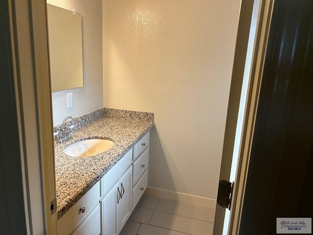 bathroom featuring tile patterned floors and vanity