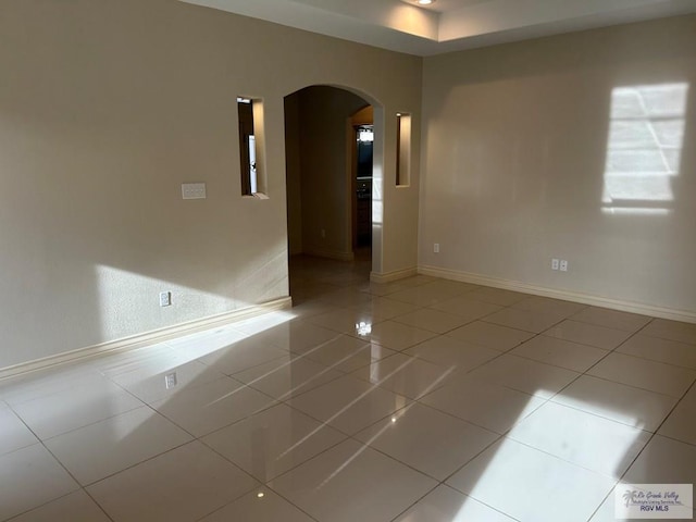 spare room with tile patterned flooring