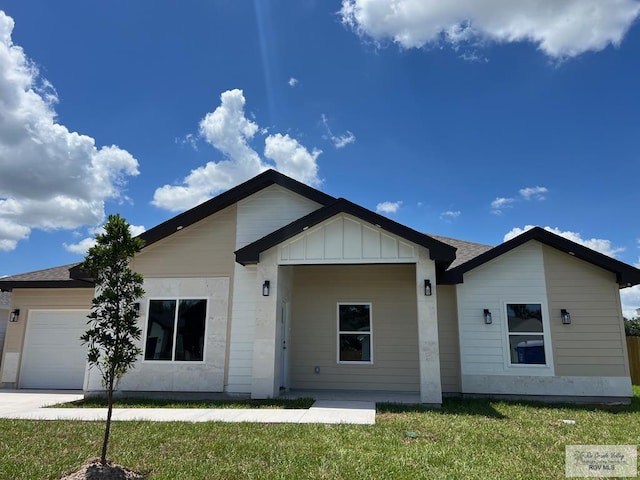 single story home featuring a front yard and a garage