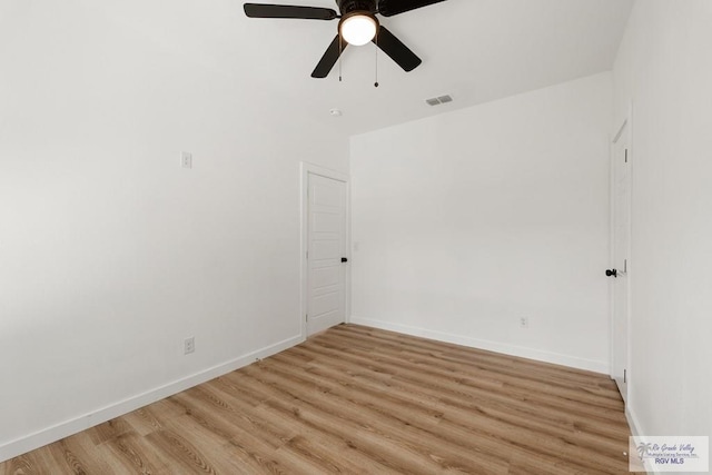 empty room with light hardwood / wood-style floors and ceiling fan