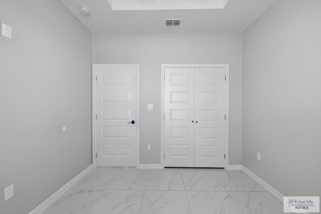 unfurnished bedroom with a closet