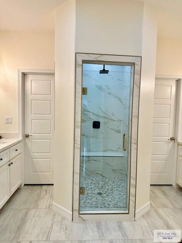 bathroom with vanity and an enclosed shower