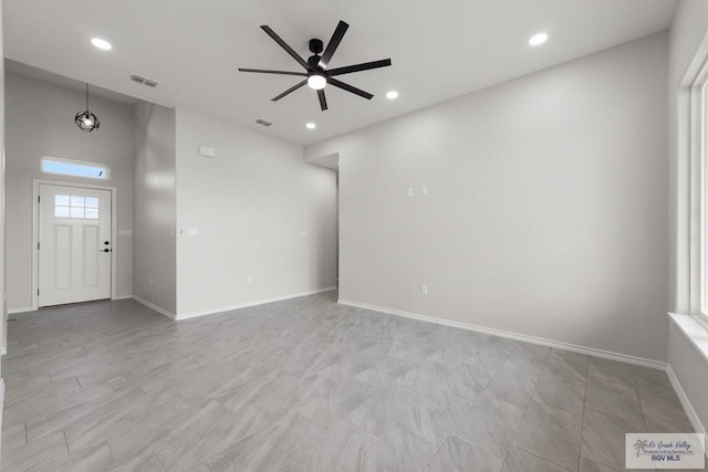 unfurnished living room featuring ceiling fan