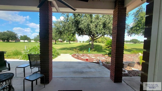 view of patio featuring ceiling fan