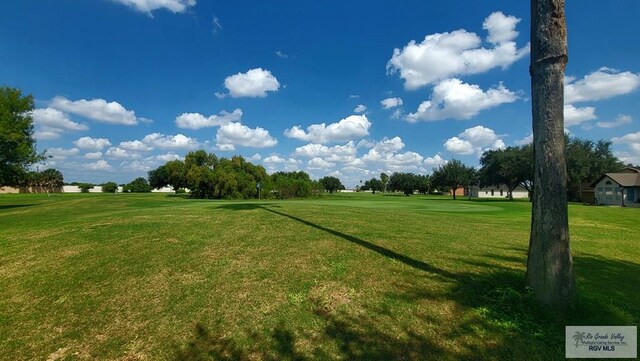 surrounding community with a yard