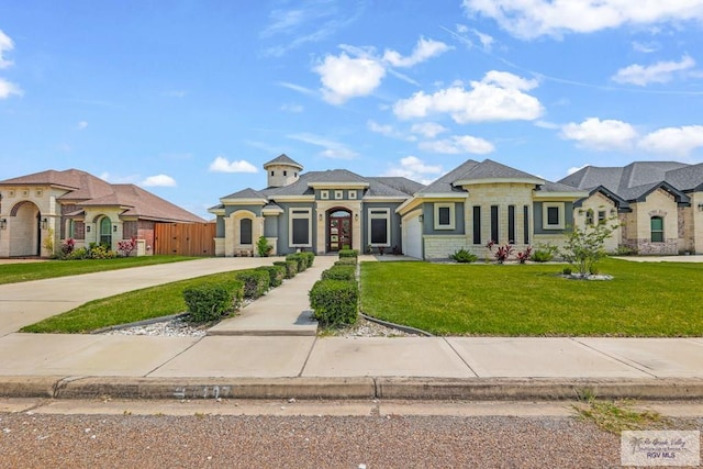 french provincial home with a front yard