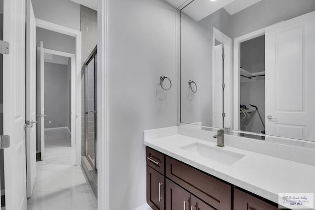 bathroom featuring vanity and walk in shower