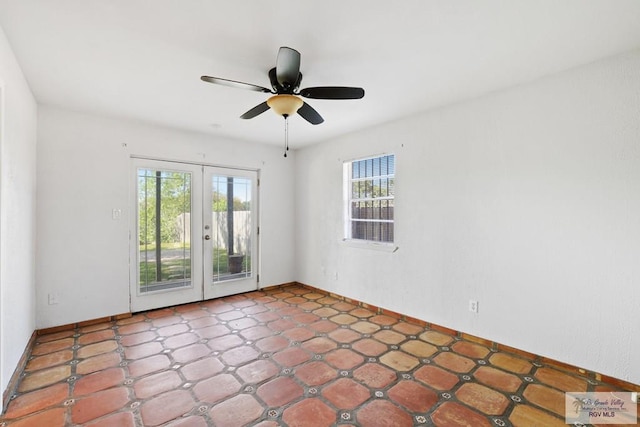 empty room with french doors, baseboards, and ceiling fan