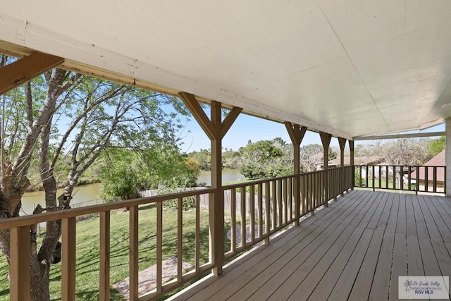 wooden terrace with a water view