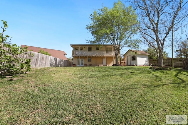 view of yard with a fenced backyard, a storage shed, and an outdoor structure