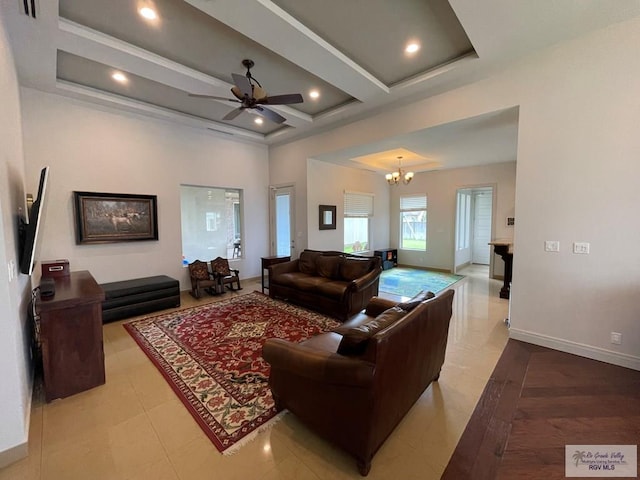 tiled living room featuring beamed ceiling, ceiling fan with notable chandelier, and coffered ceiling