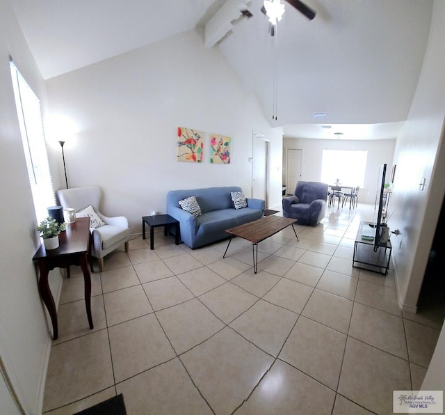 living room featuring beamed ceiling, high vaulted ceiling, ceiling fan, and light tile patterned flooring