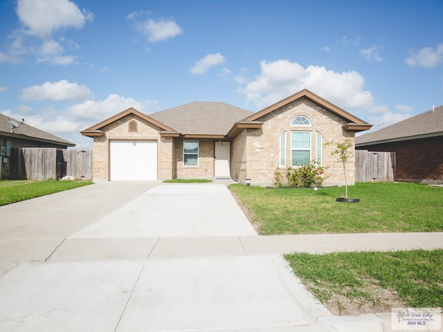 ranch-style home featuring a front yard and a garage