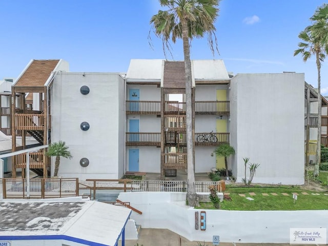6201 Padre Blvd Unit 106, South Padre Island, TX 78597 - view of building exterior with stairs