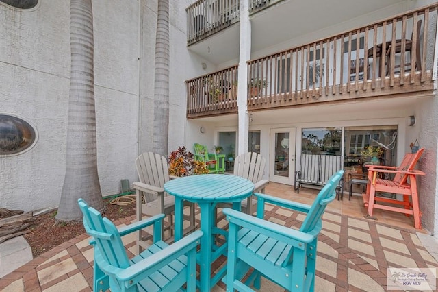 6201 Padre Blvd Unit 106, South Padre Island, TX 78597 - view of patio with a balcony and outdoor dining area