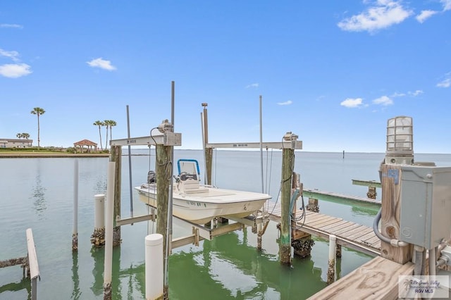 6201 Padre Blvd Unit 106, South Padre Island, TX 78597 - dock area with boat lift and a water view