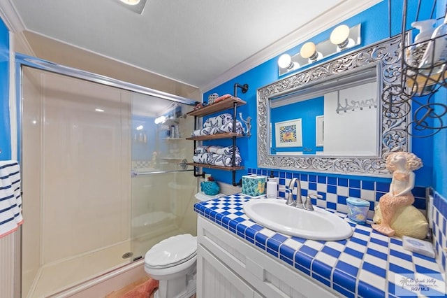 6201 Padre Blvd Unit 106, South Padre Island, TX 78597 - full bathroom featuring a shower stall, vanity, toilet, crown molding, and tasteful backsplash