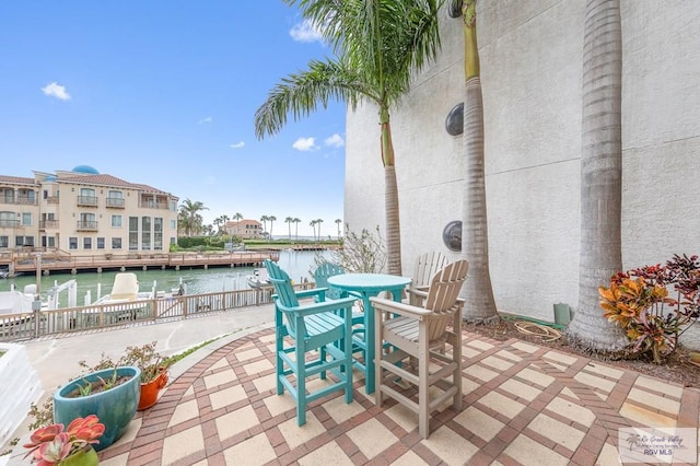 view of patio featuring a water view