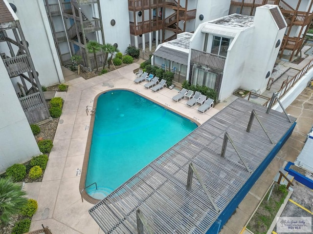 view of swimming pool featuring a patio