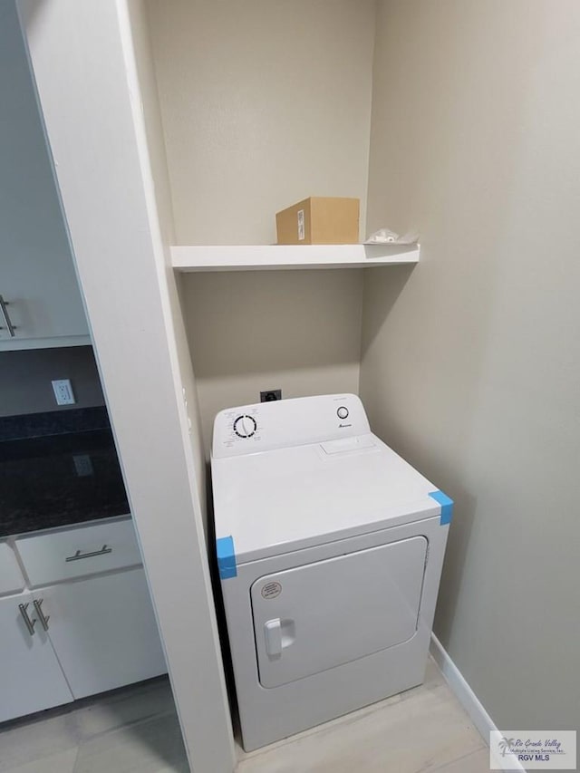 washroom with washer / dryer