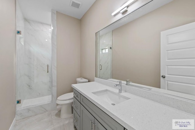 full bath with a marble finish shower, visible vents, toilet, marble finish floor, and vanity