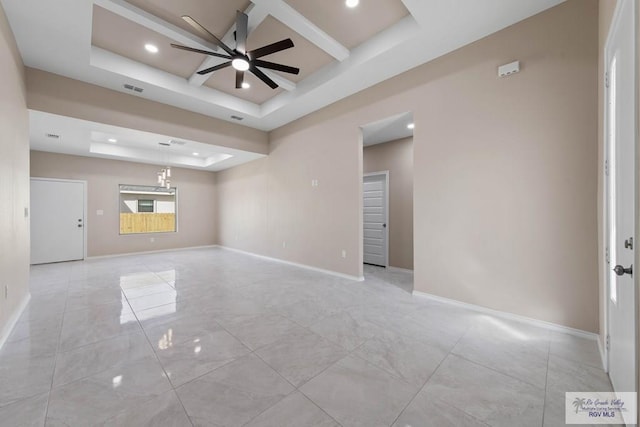 unfurnished living room with visible vents, baseboards, recessed lighting, ceiling fan, and a raised ceiling