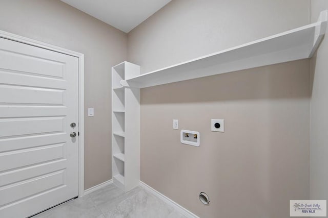 laundry area with baseboards, hookup for an electric dryer, hookup for a washing machine, and laundry area