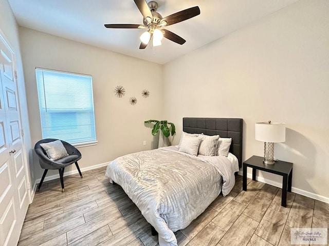 1505 Shavano Dr, Edinburg, TX 78541 - bedroom with light wood-style floors, baseboards, and a ceiling fan