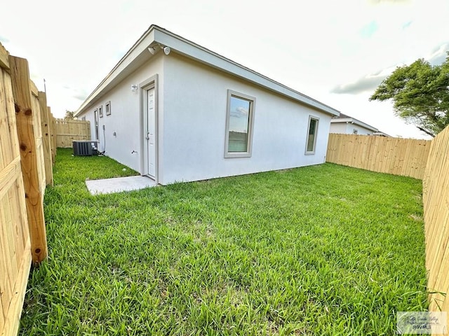 1505 Shavano Dr, Edinburg, TX 78541 - back of property featuring cooling unit and stucco siding