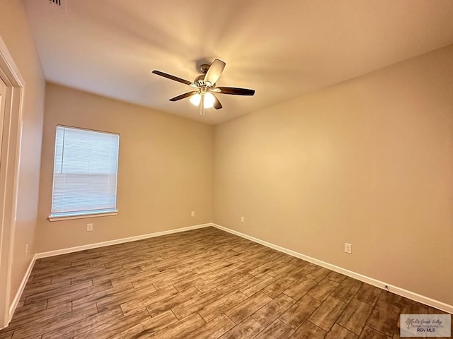 1505 Shavano Dr, Edinburg, TX 78541 - unfurnished room with dark wood finished floors, ceiling fan, and baseboards