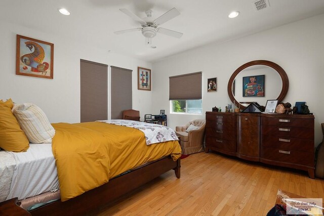 bedroom featuring light hardwood / wood-style flooring and ceiling fan